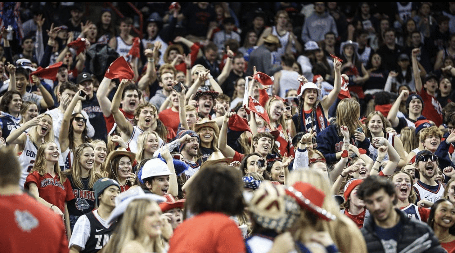 Gonzaga Kennel Club student section passionately cheering and supporting their team with unwavering enthusiasm