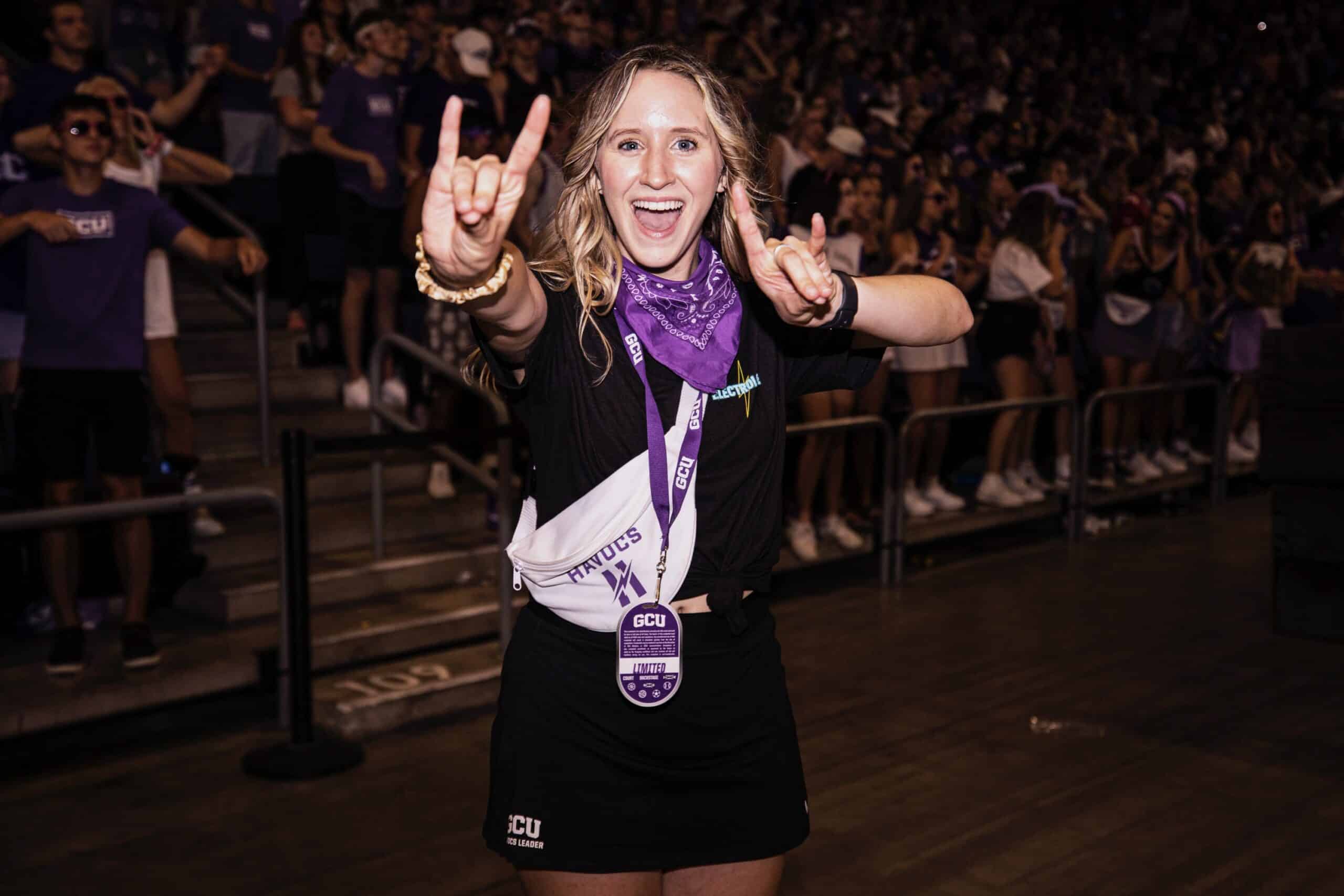 GCU Havocs student section leader motivating the student section on basketball game day.