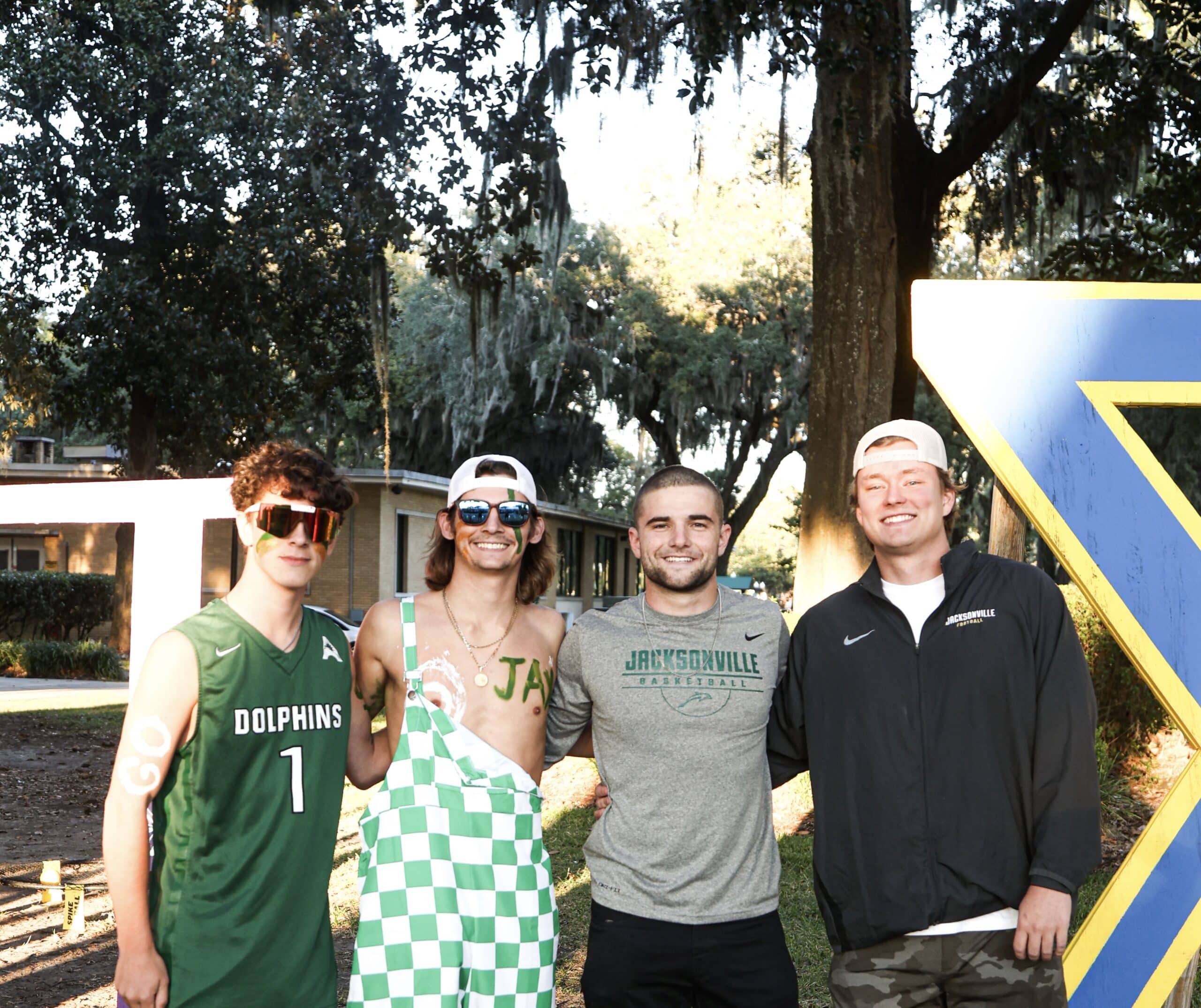 Jacksonville University Phinatics student section leaders pose for a photo at the pre-game tailgate