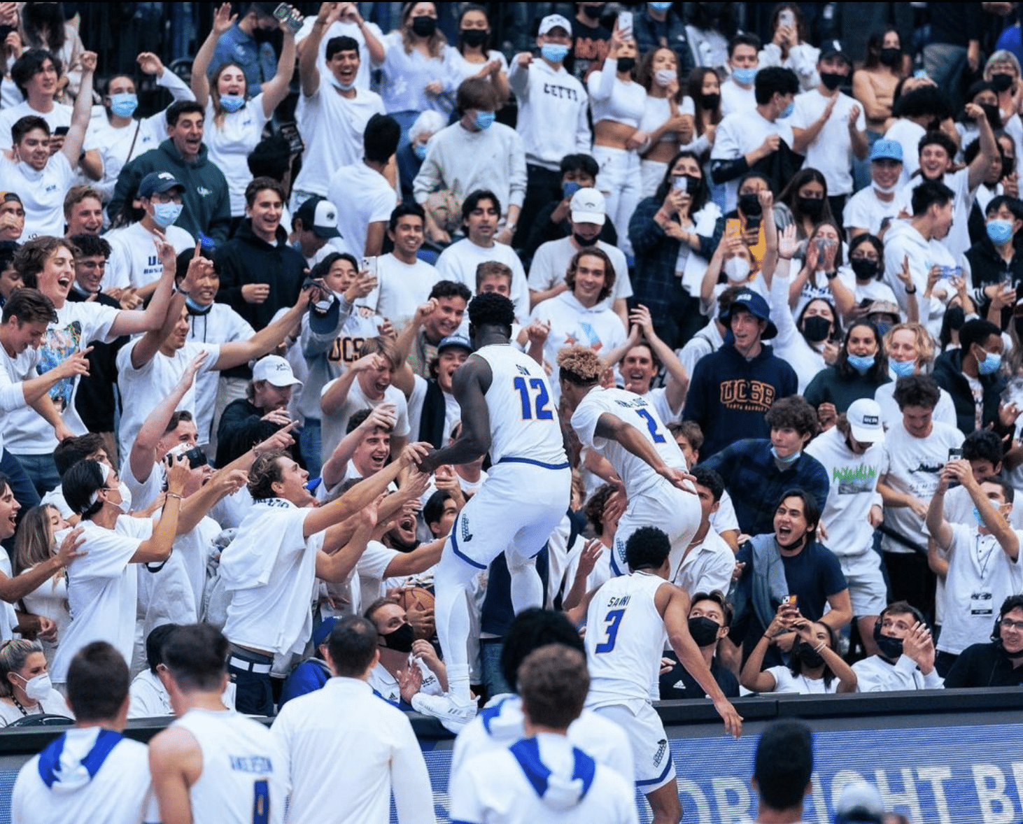 UCSB student section celebrate their basketball team